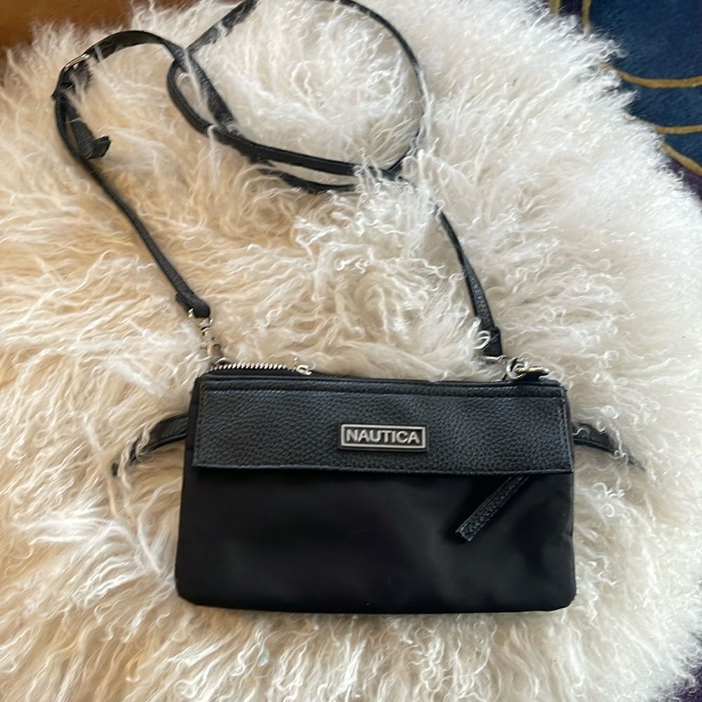 Nautica cross body bag.  Adjustable with plenty of pockets. Great little bag.